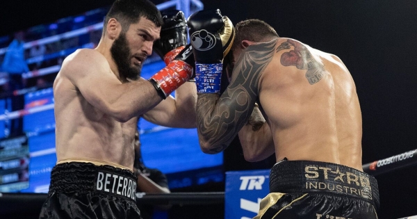 Peterbiev defeated Smith via knockout and unified the heavyweight and lightweight titles.