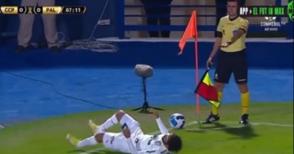 Only in South America… the referee prevents a player from taking a corner